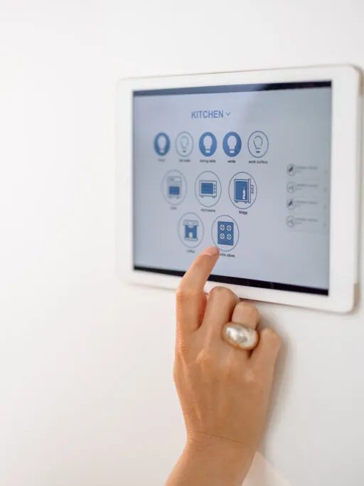 A modern home security alarm monitoring panel mounted on a wall, offering round-the-clock protection and emergency alerts for families in metro Atlanta.