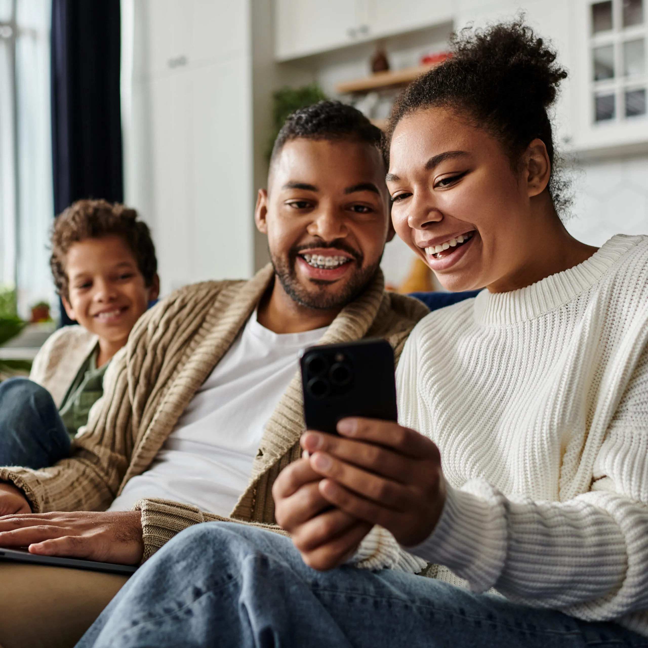A homeowner interacting with their newly installed smart home security alarm touchpad, bringing peace of mind and round-the-clock protection.